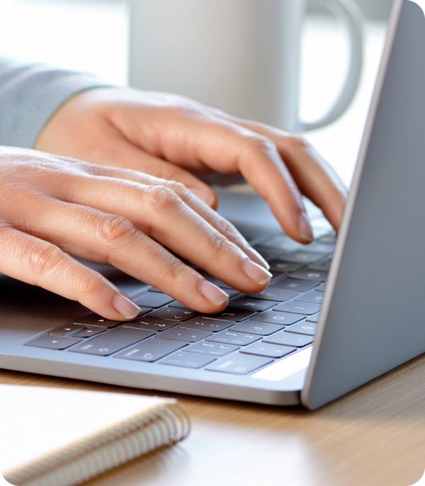 Typing on laptop